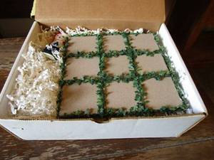 lot 126 image: HAND MADE RAGGEDY ANN AND ANDY PORCELAIN STONE TIC TAC TOE GAME.&nbsp HAND PAINTED CERAMIC CHARACTERS AND STONE GAME BOARD WITH GREENERY.&nbsp