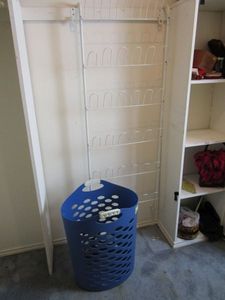 lot 214 image: BLUE HAMPER AND HANGING SHOE RACK
