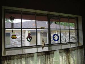 lot 229 image: STAINED GLASS WINDOW DECOR AND WIND CHIMES