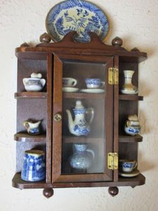 lot 91 image: WALL MOUNTED DISPLAY W CHINA PIECES INCL.