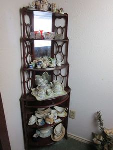lot 97 image: CORNER DISPLAY SHELF UNIT W MIRROR, CONTENTS NOT INCL.