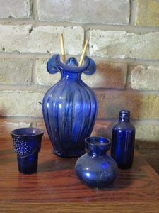 lot 193 image: COBALT GLASS VASE AND BLUE GLASS BOTTLES