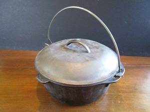 lot 287 image: CAST IRON DUTCH OVEN WITH LID AND HANDLE