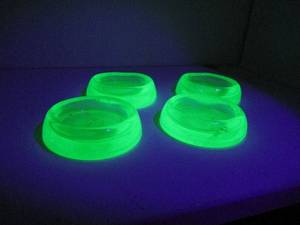 lot 309 image: DEPRESSION ERA URANIUM GLASS FURNITURE SLIDERS