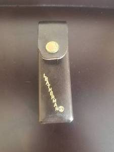 lot 9 image: Leatherman tool with carry case