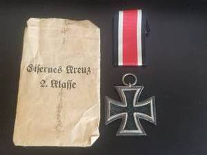 lot 20 image: Original WWII - German 1939 Iron Cross 1st class, ribbon, and envelope (reads  Sisernes Cross 2nd class)