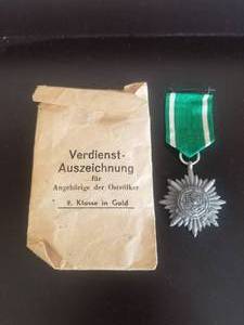 lot 36 image: WWII German decoration for Gallantry and Merit - Eastern People, also envelope (reads Merit award members for of the Eastern Peoples)