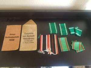 lot 65 image: Selection of WWII German ribbons and bags of issues (War Service Medal), (Bravery and Merit award with swords)