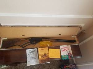 lot 31 image: Red Ryder 2000 Millennium Edition Daisy BB gun with booklets and box, along with safety glasses