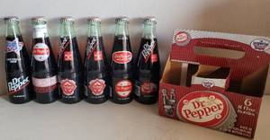 lot 37 image: VINTAGE DR. PEPPER COMMEMORATIVE BOTTLES WITH CARTON CARRIER AS SHOWN.