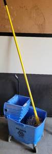 lot 44 image: COMMERCIAL STYLE MOP BUCKET WITH MOP AS SHOWN.