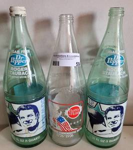 lot 59 image: VINTAGE 1970S DR. PEPPER COMMEMORATIVE 32OZ BOTTLES AS SHOWN.