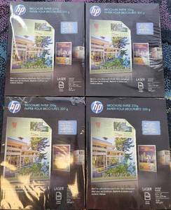 lot 64 image: LOT OF 4 PACKS OF BROCHURE PAPER GLOSSY GLACE AS SHOWN.