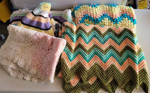 lot 146 image: LOT OF 4 CROCHETED BLANKETS IN ASSORTED STYLES AND SIZES AS SHOWN. (SOLD 4 X THE MONEY)