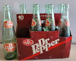 lot 156 image: VINTAGE DR. PEPPER 8-PACK 10 OZ GLASS BOTTLES WITH CARRIER AS SHOWN.