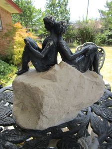 lot 69 image: COUPLE SITTING ON ROCK STATUE&nbsp