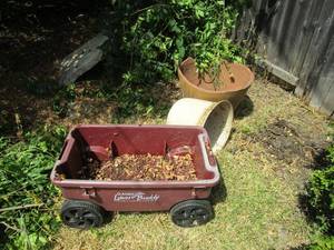 lot 72 image: LARGE CLAY POT, PLASTIC POT, &amp WAGON