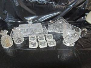 lot 159 image: CRYSTAL BUTTER DISH WLID, CRYSTAL PITCHER, CRYSTALTEA LIGHT CANDLE HOLDERS, CRYSTAL SALTPEPPER SHAKERS, EGG SERVING DISH, &amp CRYSTAL NAPKIN HOLDER