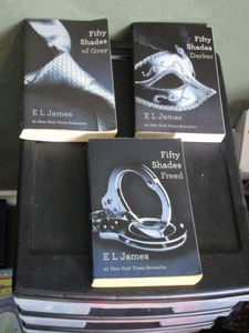 lot 187 image: 50 SHADES OF GREY TRILOGY BOOK SET