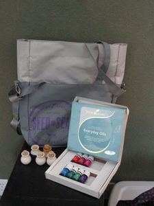 lot 250 image: YOUNG LIVING EVERYDAY OILS, SMALL BOTTLES, &amp CARRYING BAG