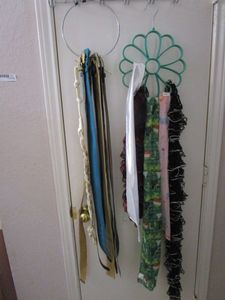 lot 277 image: METAL RING OF BELTS &amp ACCESSORIE HANGER WITH SCARVES
