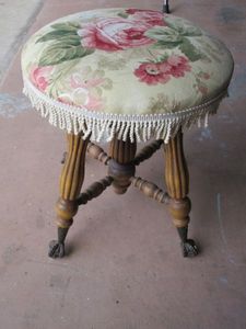 lot 337 image: VINTAGE STOOL KNITTED FLORAL MATERIAL SEAT WTASSELS, AMAZING DETAIL TALONS HOLDING GLASS BALLS ON FEET