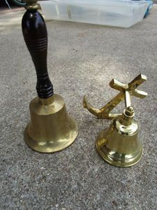 lot 391 image: BRASS BELL W WOODEN HANDLE, WALL MOUNTED BRASS BELL ATTATCHED TO ANCHOR