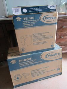 lot 379 image: NIB PROFLO TOILET, INCL. BOWL, TANK & SEAT