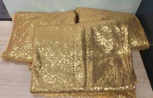 lot 150 image: LOT OF 3 GOLD SHIMMER BACKDROP CURTAINS AS SHOWN. (SOLD 3 X THE MONEY) APPROX. 60.5 W x 114 L.