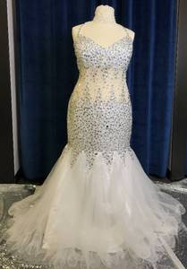 lot 16 image: SEQUINS SEE THROUGH WEDDING DRESS IN DESIGN AND COLOR AS SHOWN.