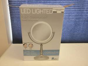 lot 186 image: ZADRO LED LIGHTED NEXT GENERATION ROUND VANITY CORDLESS MIRROR IN BOX AS SHOWN.