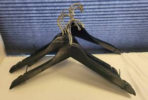 lot 238 image: LOT OF WOODEN CLOTHES HANGERS IN STYLE SHOWN.