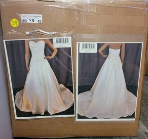 lot 42 image: LOT OF 5 NEW WEDDING DRESSES IN ASSORTED STYLES, COLORS, AND SIZES AS SHOWN. SEE ALL PICTURES (SOLD 5 X THE MONEY)