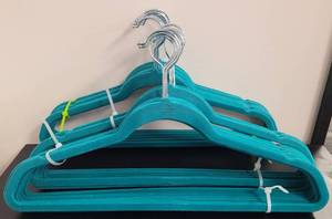 lot 392 image: LOT OF VELVET HANGERS IN COLOR AS SHOWN.