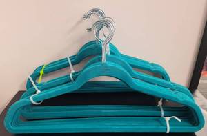 lot 394 image: LOT OF VELVET HANGERS IN COLOR AS SHOWN.