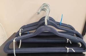 lot 411 image: LOT OF VELVET HANGERS IN COLOR AS SHOWN.