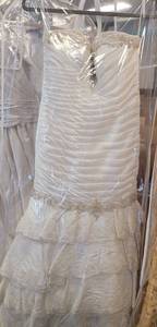 lot 443 image: WEDDING DRESS IN DESIGN AND COLOR AS SHOWN. SIZE 6.
