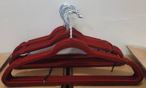 lot 486 image: LOT OF VELVET HANGERS IN COLOR AS SHOWN.