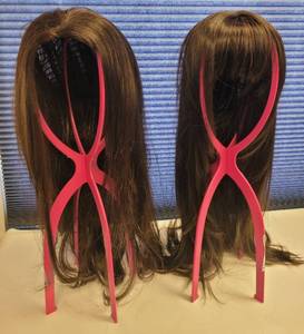 lot 528 image: LOT OF 2 WIGS IN STYLE AND COLOR(S) AS SHOWN WITH SINGLE COLLAPSIBLE WIG HOLDER. (SOLD 2 X THE MONEY)