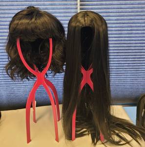 lot 531 image: LOT OF 2 WIGS IN STYLE AND COLOR(S) AS SHOWN WITH SINGLE COLLAPSIBLE WIG HOLDER. (SOLD 2 X THE MONEY)