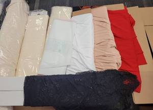 lot 532 image: LARGE LOT OF ASSORTED FABRICS  MATERIAL IN STYLES, DESIGNS, AND COLOR(S) SHOWN.