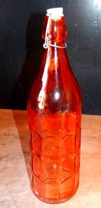 lot 79 image: COOL VINTAGE RED GLASS BOTTLE WITH FLIP LOCKING STOPPER