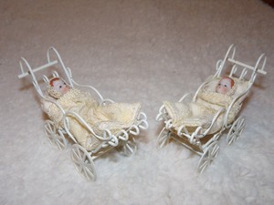 lot 123 image: 2 VINTAGE SMALL PORCELAIN BABY DOLLS IN CARRIAGES&nbsp