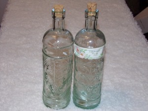 lot 187 image: 2- VINTAGE CORK GRAPE DESIGN GLASS BOTTLES