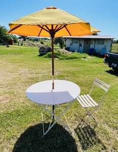 lot 33 image: Vintage Metal Patio Table with Metal Chair and Wooden &amp Canvas Umbrella