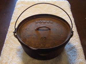 lot 39 image: Large Cast Iron Dutch Oven Lid Lifter 12.5 Wide 6.5 Tall