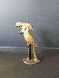 lot 7 image: Rustic cast Parrot bottle opener