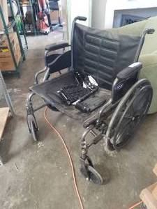 lot 52 image: Invacare wheelchair with feet rest