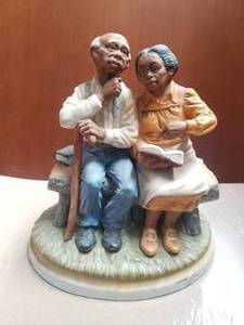 lot 89 image: Masterpiece by Homco - couple on bench figurine