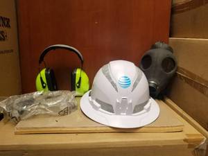 lot 202 image: Selection of safety equipment - goggles, hard hat, ear protectors, and a gas mask